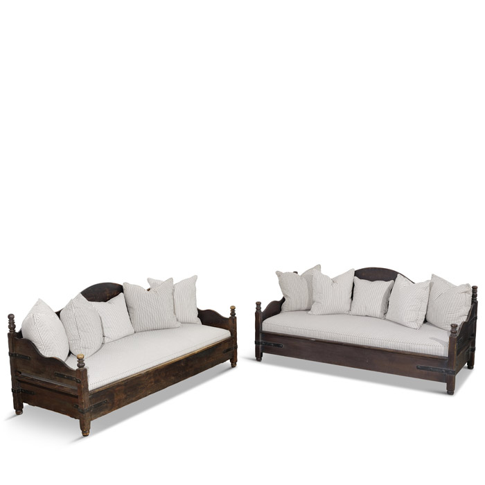 a Pair of Monterey Iron Mounted Stained Wood Settees estimated at 1200 – 1800