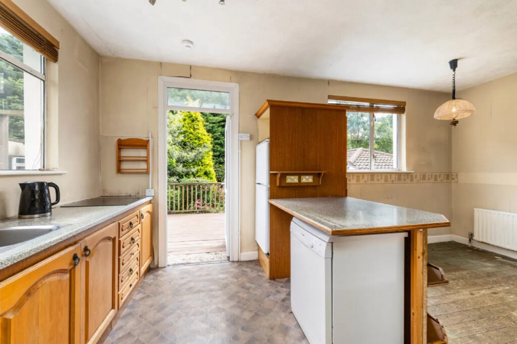 Does the renovation of this home and building to the side make financial sense? 4 kitchen 5