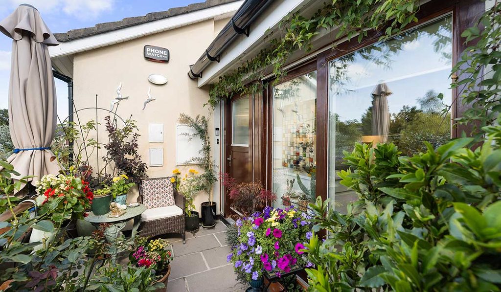 Druids court balcony with flowers 2 1