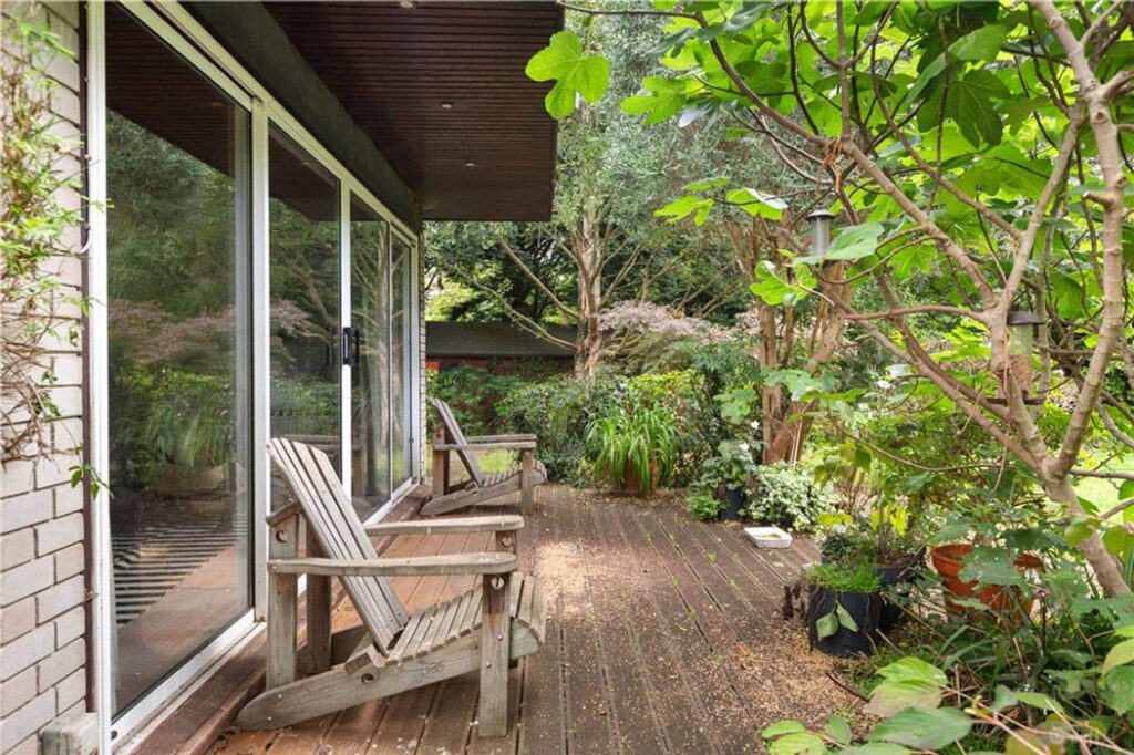 a terrace wraps around the house